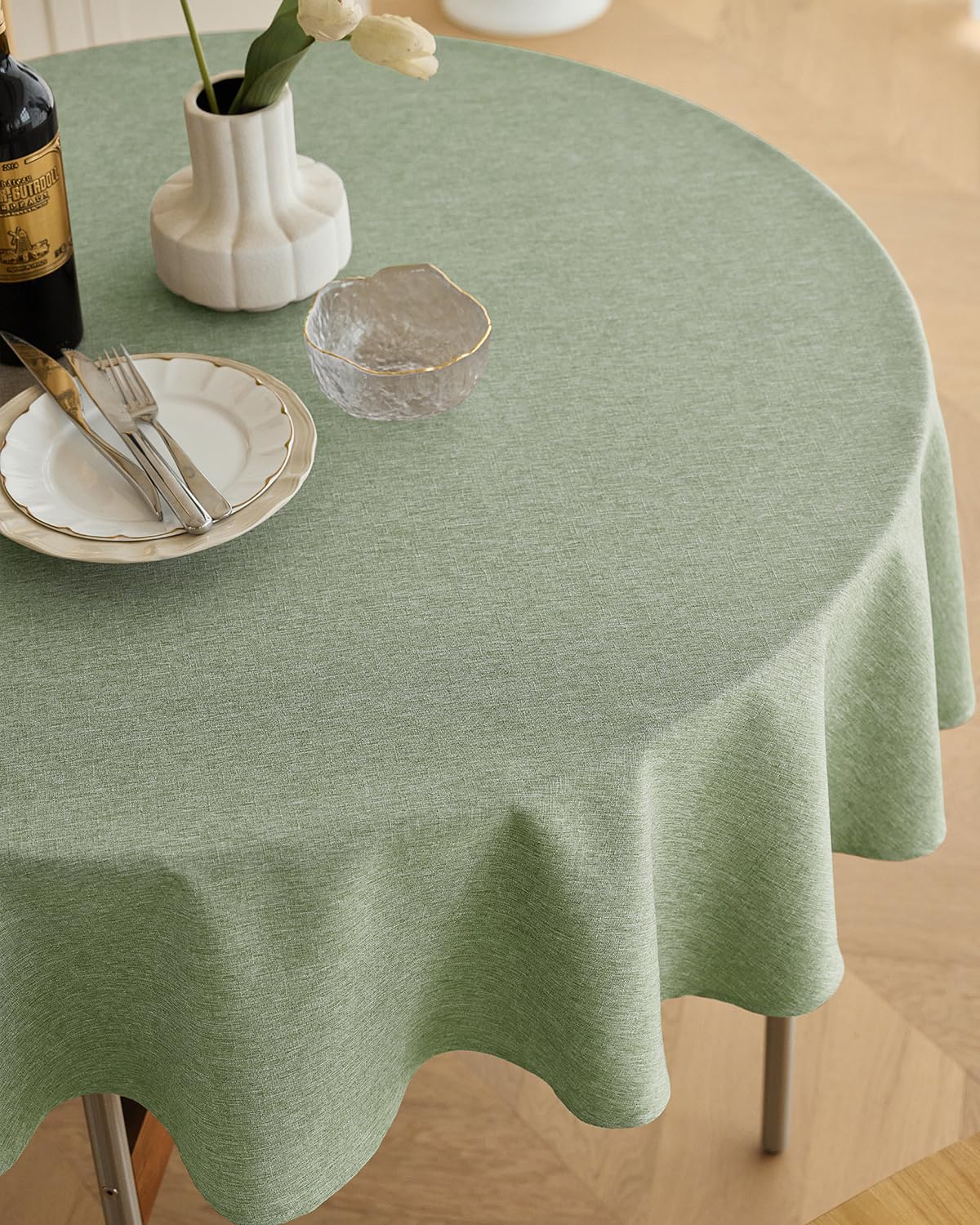 Decorelia waterproof round tablecloth in sage green for outdoor use