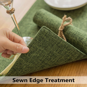 Demetex Green placemats on a dining table highlighting craftsmanship with hand-cut edges.