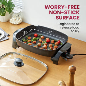Elite Gourmet EG-6203X vented glass lid shows cooking progress.