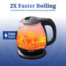 Elite Gourmet EKT1001 glass kettle showing blue LED interior while boiling