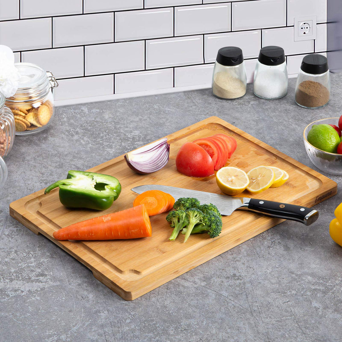 Empune cutting board with built-in side handles for easy transport