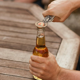 EUUPS vintage bottle opener in hand for easy, secure bottle opening.