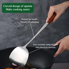 Evanda wok spatula head designed for flipping and stirring in wok.