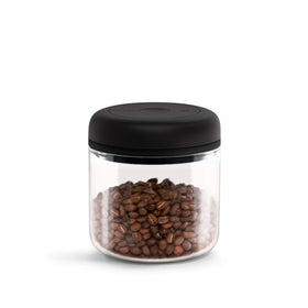 Fellow Atmos vacuum canister 1.2L filled with coffee beans preserves freshness.