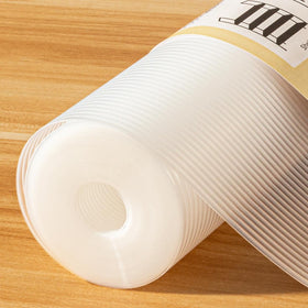 FEXIA shelf liner in a kitchen cabinet with oil-proof surface for easy care