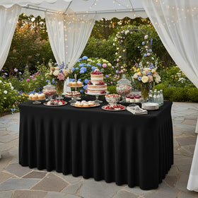 Fixwal dessert table setup with black table skirt enhancing ambiance