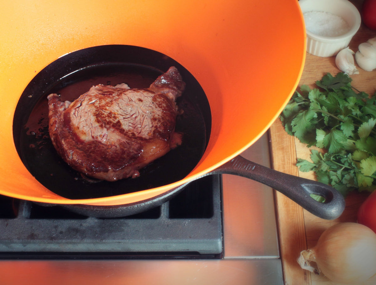 Frywall spillover prevention aids when sautéing large batches of vegetables.