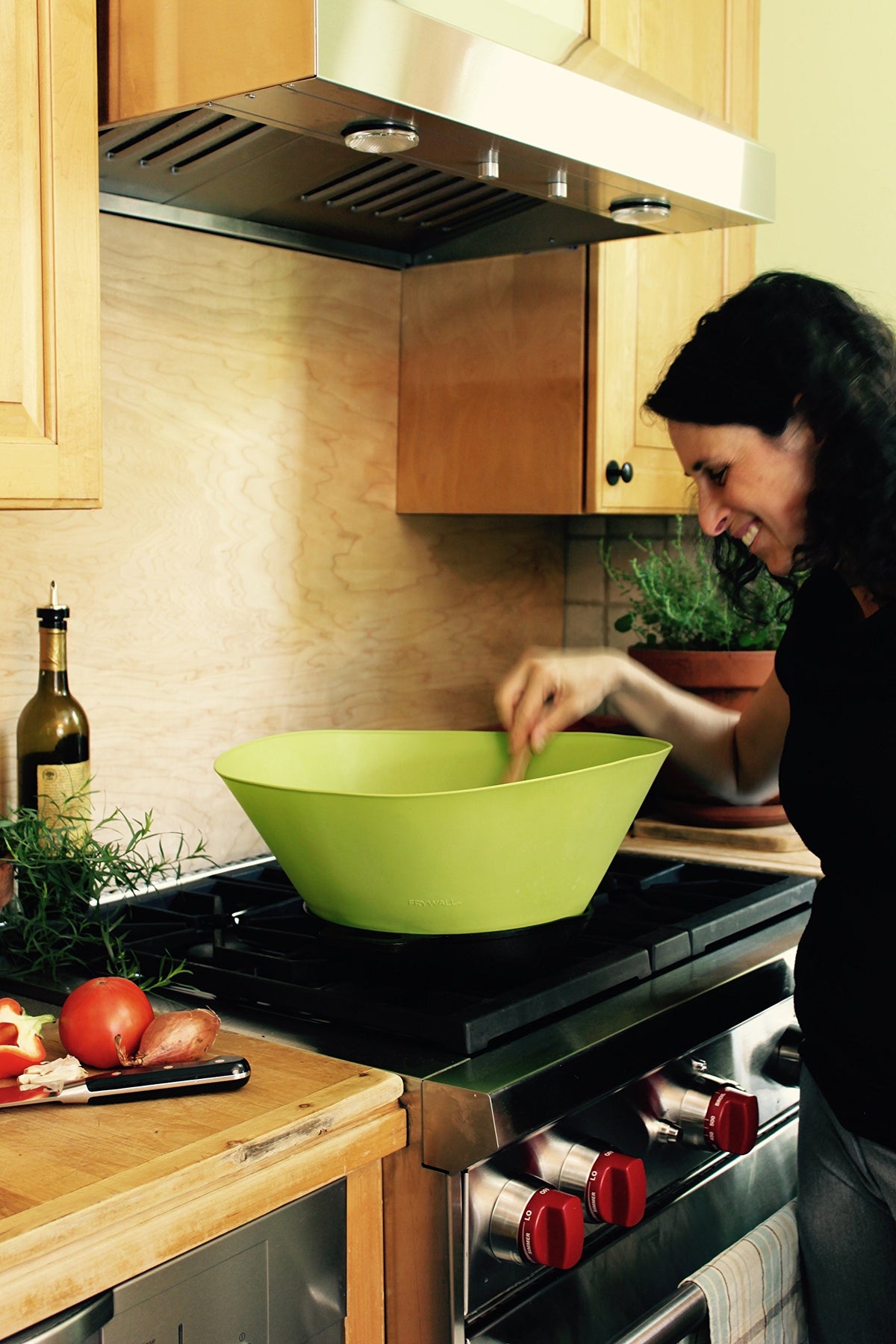 Frywall spillover stopper protects against overflow during sautéing.