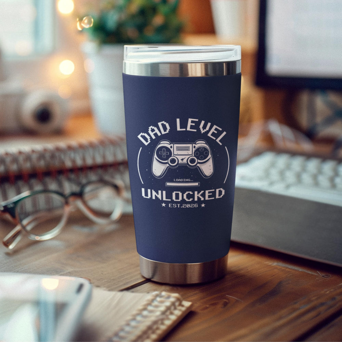 FUNITZ Promoted to Dad 2026 tumbler resting on a desk.
