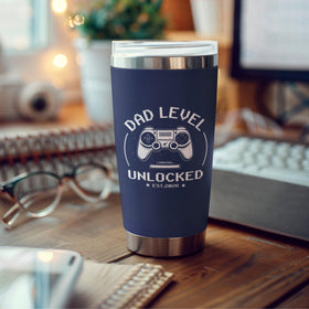 FUNITZ Promoted to Dad 2026 tumbler resting on a desk.