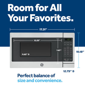 GE microwave interior illustrating 0.7 cu ft capacity for quick heating and defrosting