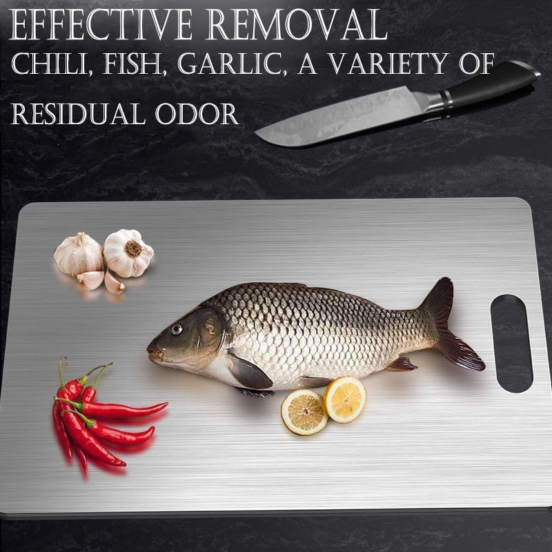 Generic titanium cutting board under running water for easy cleaning and quick-dry.