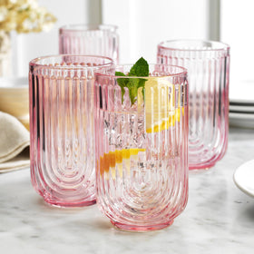 Glaver's pink arch highball glass adds a vibrant touch for entertaining.