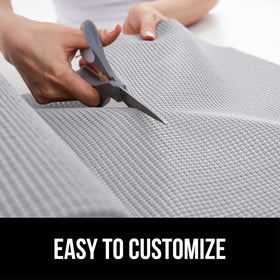 Bathroom vanity shelf organized with non-adhesive breathable mat