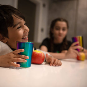 Greens Steel rainbow finish tumbler in action with ice and juice
