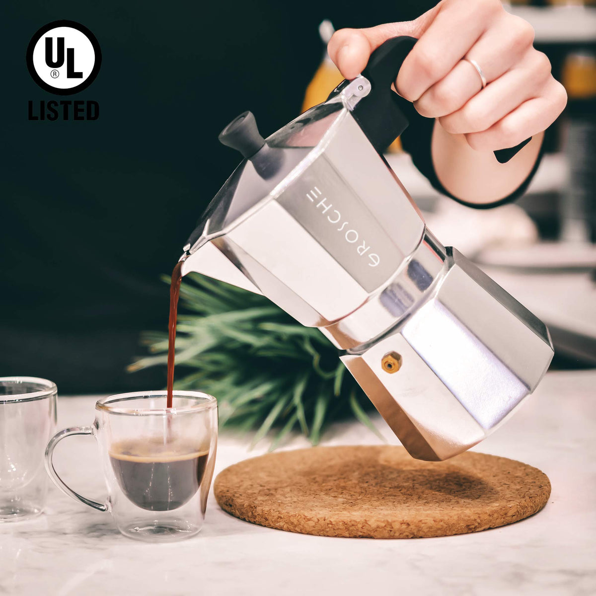 Milk frothing readiness with GROSCHE Milano moka pot for creamy drinks.