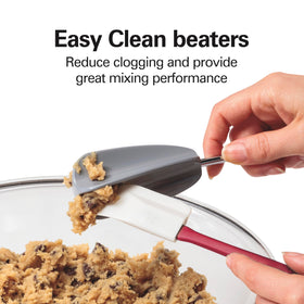 Hamilton Beach hand mixer with attachments including dough hooks and whisk.