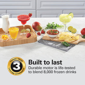 Hamilton Beach 40-oz glass jar in use for large-batch smoothies and drinks.