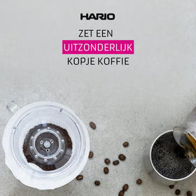 Hario V60 02 ceramic red dripper beside a cup