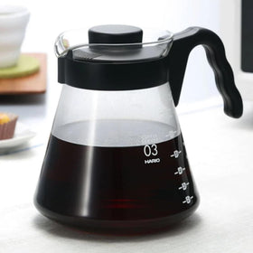 Hario V60 glass coffee server handle enables safe, controlled pouring.