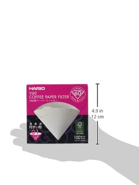 Hario V60 Size01 white filters spread on table ready for brew.