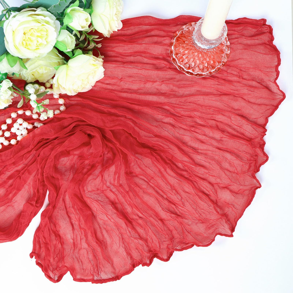 Heneger chair sash accents with red runners elevate event styling.