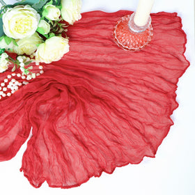 Heneger chair sash accents with red runners elevate event styling.