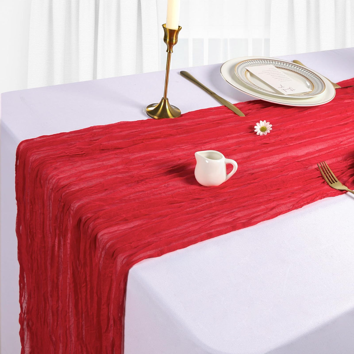 Heneger wedding table setup with red runners creates a romantic atmosphere.