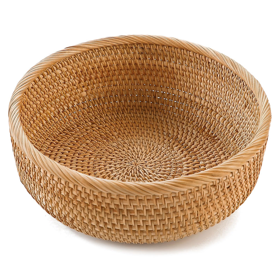 Hitomen round bread basket in natural rattan for kitchen serving and organization.