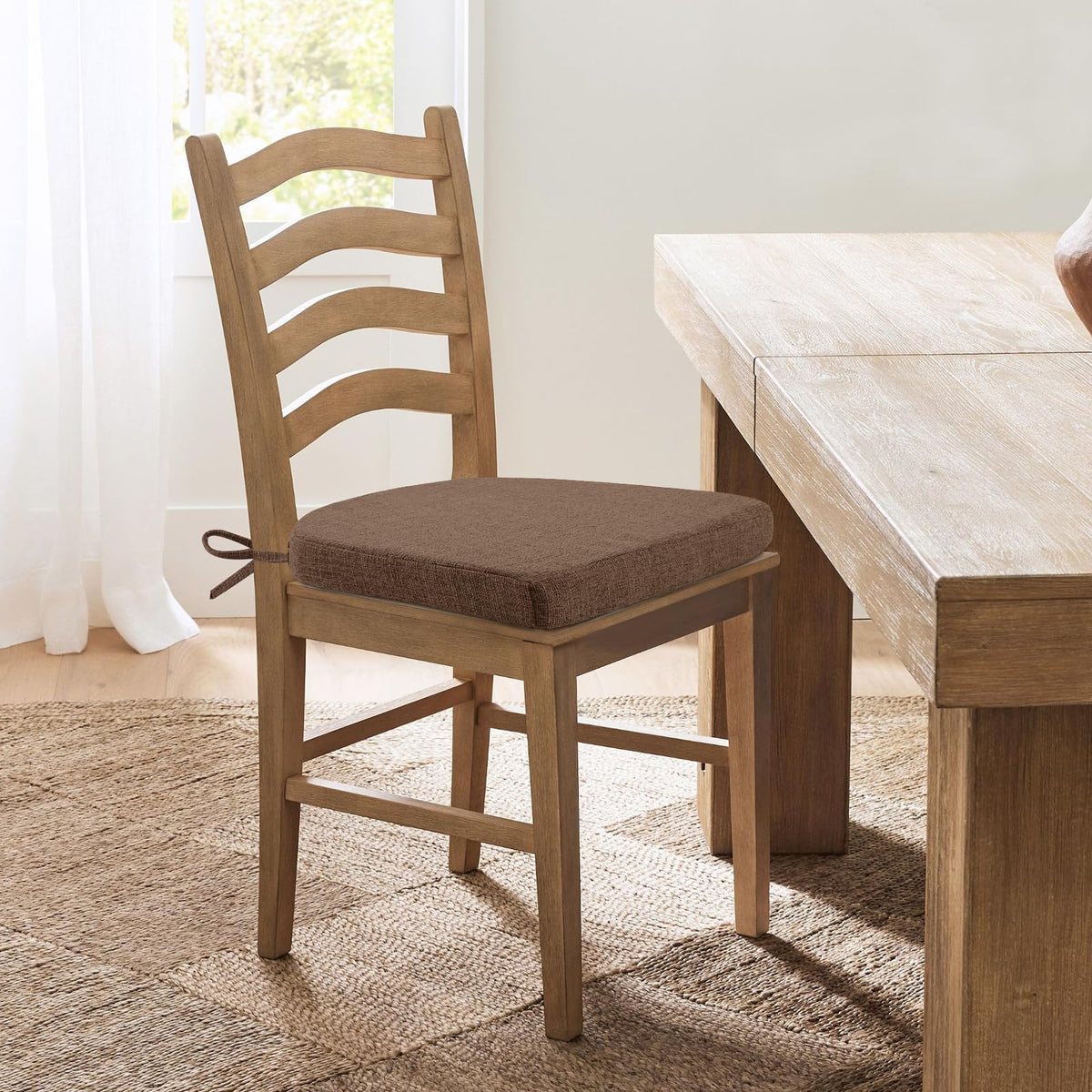 HOMELYSIAN brown cushions add warm style to dining area.