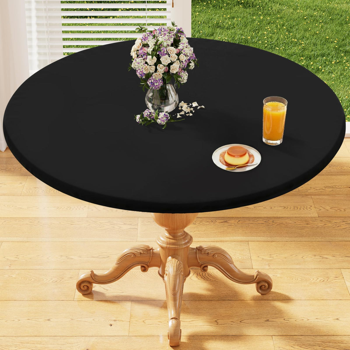 Homing round elastic fitted tablecloth on 45-56 inch table stays flat and wrinkle-free.