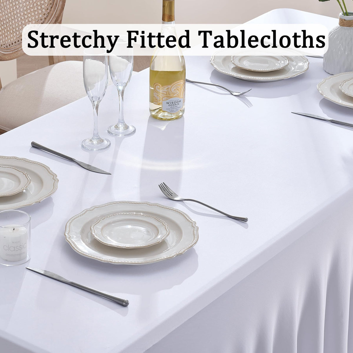 Htper white wavy spandex tablecloth on a table, adds elegant coverage.
