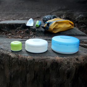 humangear GoTubb color options in clear, orange, red for quick color coding