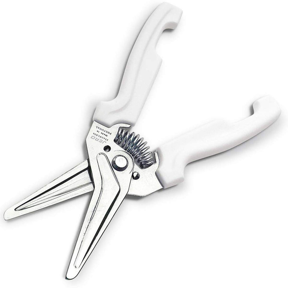 Jero spring assisted kitchen shears with holder, ready on the wall for easy storage.