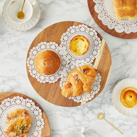 Juvale 8.5-inch lace doilies add sophistication to place settings and cake displays.