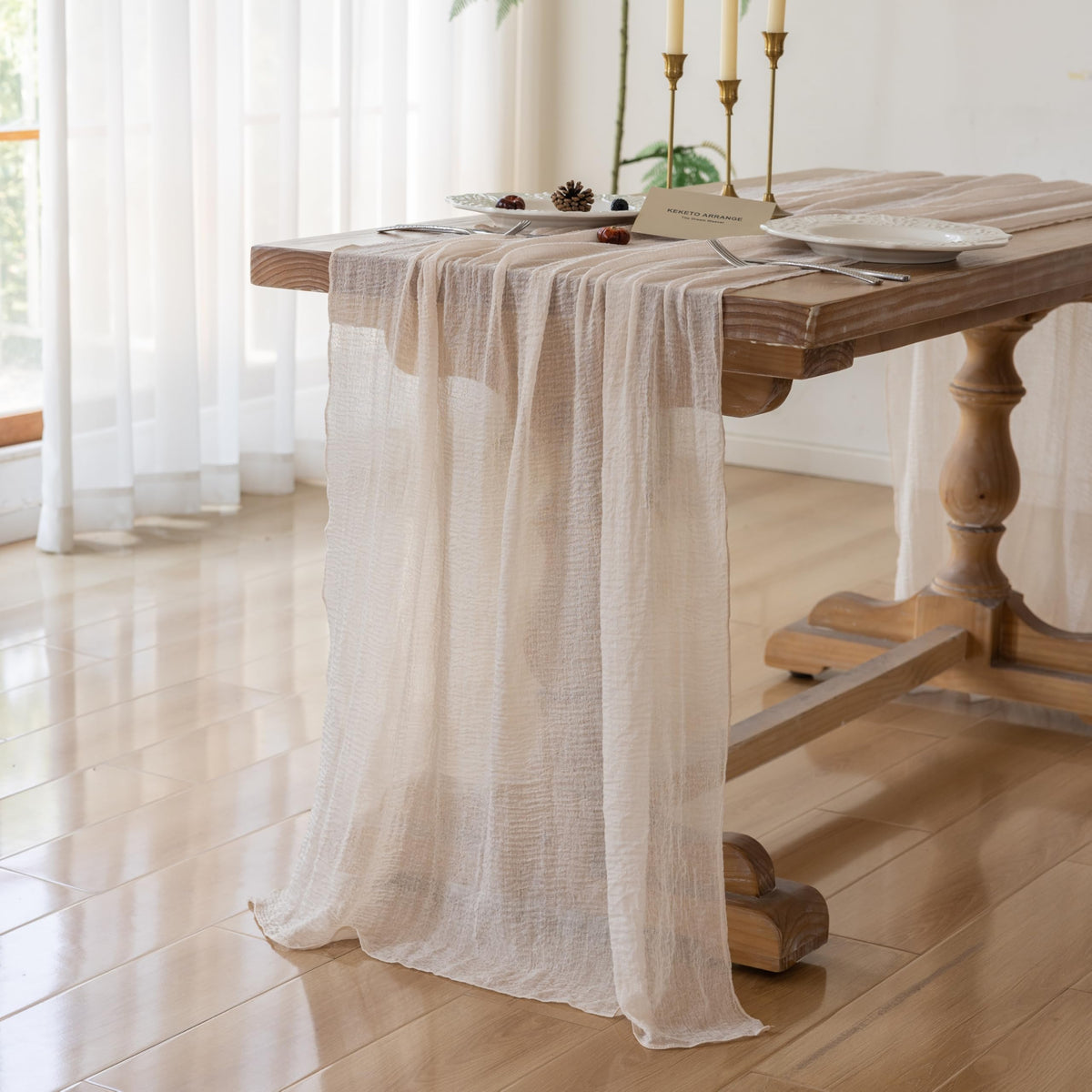 Keketoarrange beige table runner for wedding arch, enhancing delicate gauze drape.
