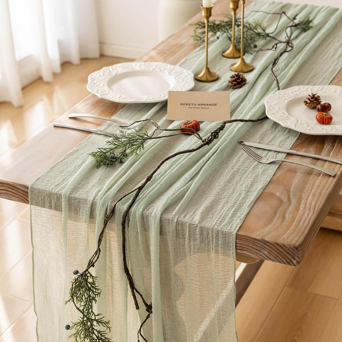 Keketoarrange sage green cheesecloth runner draped for spring wedding decor.