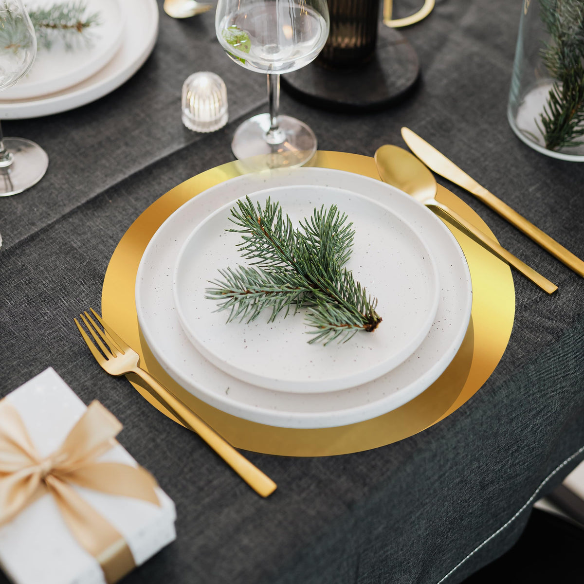KesaPlan mirrored gold charger placemats guard against spills while elevating the setting.