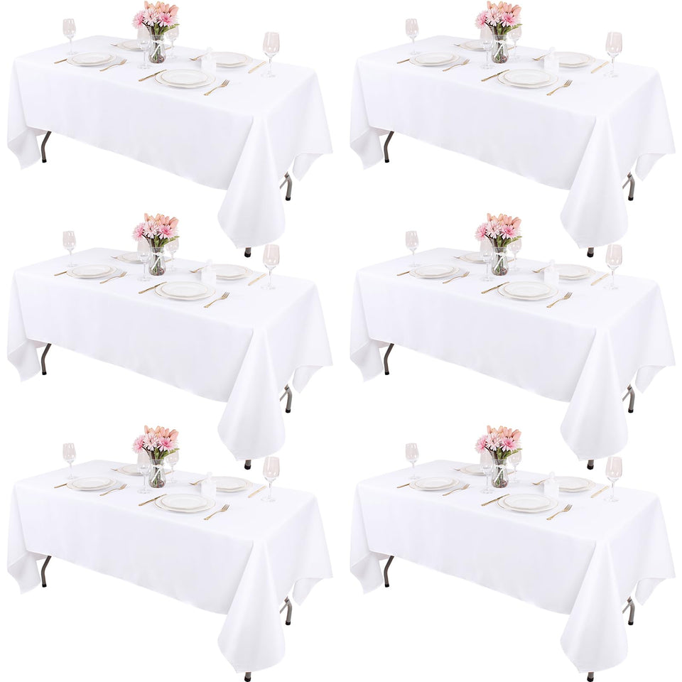 Kesfey six-pack white tablecloths 60x84 flatlay showing clean, versatile event textiles.