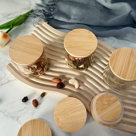 KIKINIKO Oui lids show bamboo texture and silicone rings for airtight storage.