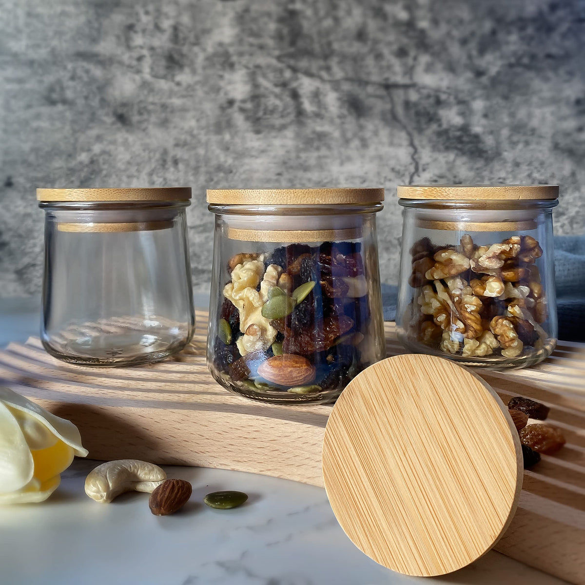 KIKINIKO Oui Yogurt Jar Lids showcase bamboo grain variations for natural aesthetic.