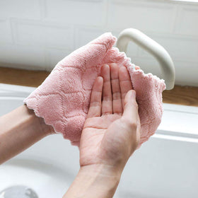 Kimteny coral velvet towels in pink-grey provide gentle cleaning for surfaces.