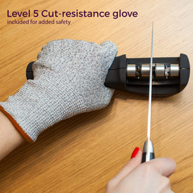 Kitchellence cut-resistant glove enhances safety during sharpening.