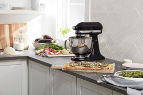 KitchenAid Artisan mixer action for whipping and mixing tasks at home.
