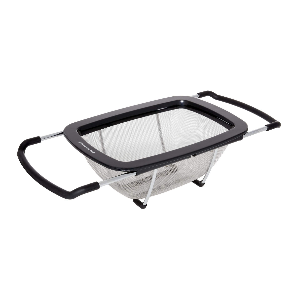 KitchenAid expandable colander with adjustable handles spanning a wide sink for drainage