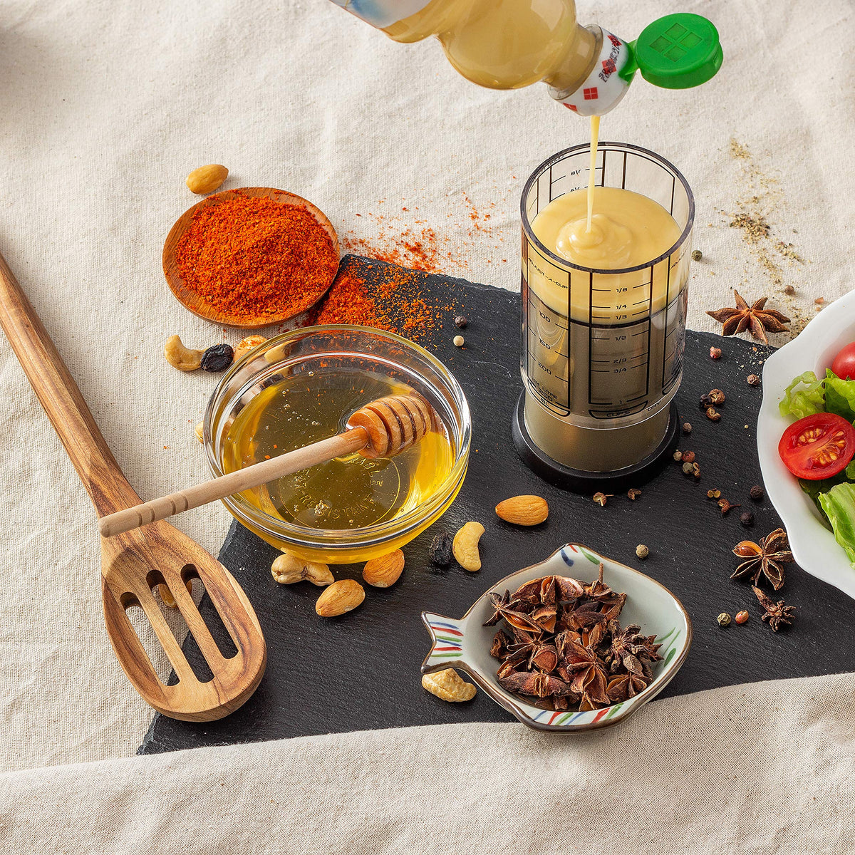KitchenArt Pro handles liquids, honey, peanut butter and more with one versatile cup.