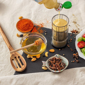 KitchenArt Pro handles liquids, honey, peanut butter and more with one versatile cup.