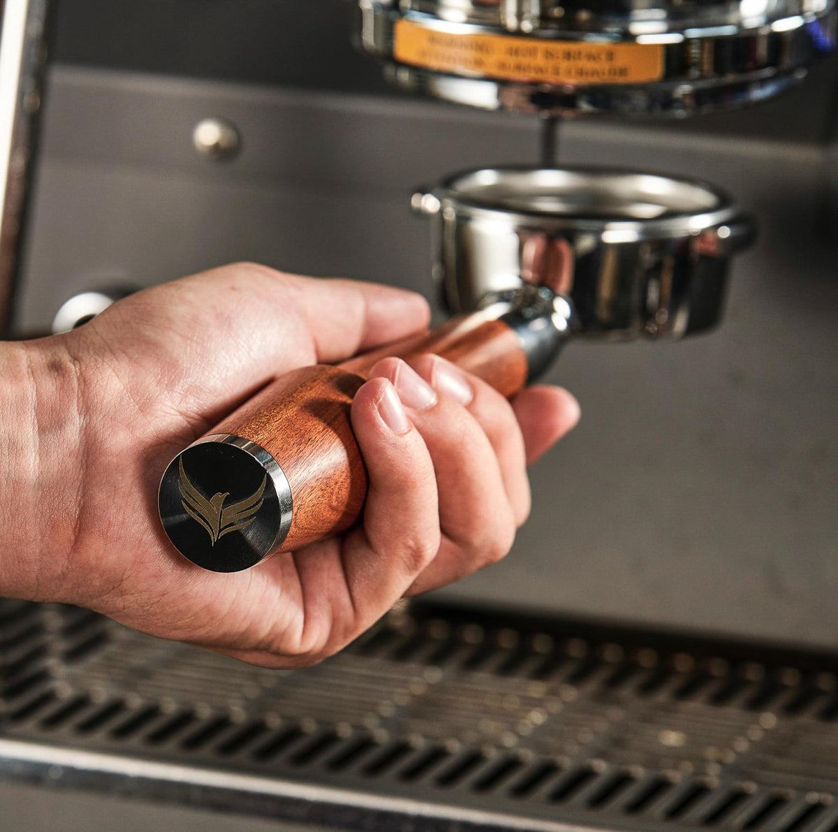 KNODOS bottomless portafilter with rosewood handle for precise shot observation.