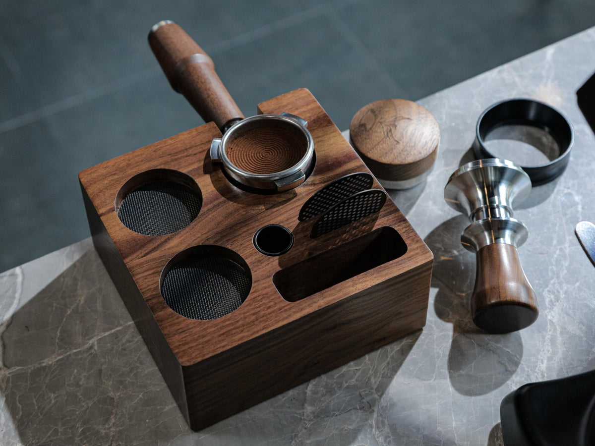 KNODOS walnut tamping station features removable silicone pads for stability