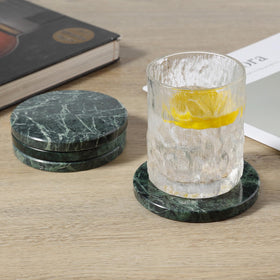 Koville 4-inch marble coasters on a coffee table scene.